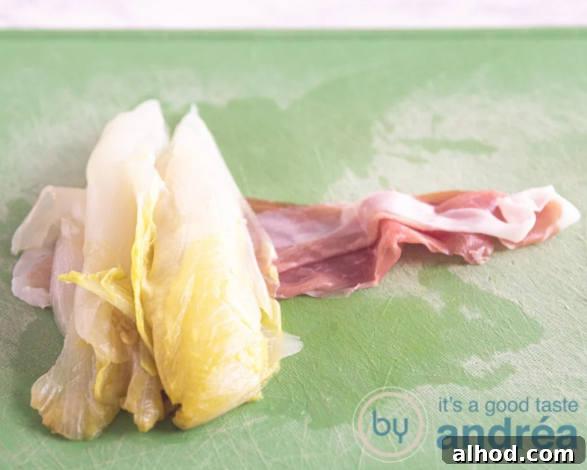 Ham and Goat Cheese Endive Gratin 6 Lay a half chicory head on a slice of prosciutto