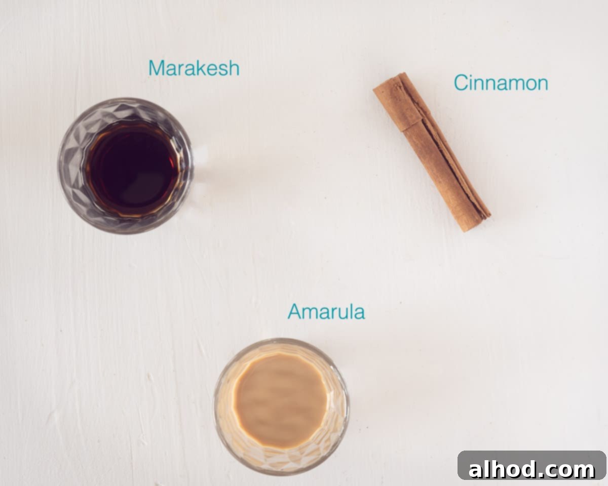 Creamy Amarula Indulgence 3 A selection of Amarula Coffee Cocktail ingredients, including Amarula liqueur, Marakesh coffee liqueur, and cinnamon sticks, artfully arranged on a clean white background with descriptive text.