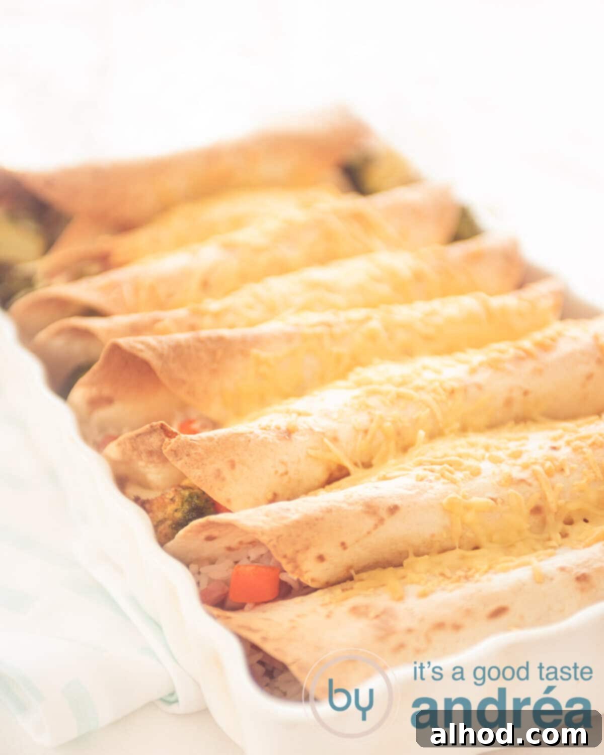 Delicious Ham and Carrot Rice Bake 2 Seven golden brown baked tortilla wraps with rice, carrot, ham, and broccoli filling in a casserole dish, fresh out of the oven