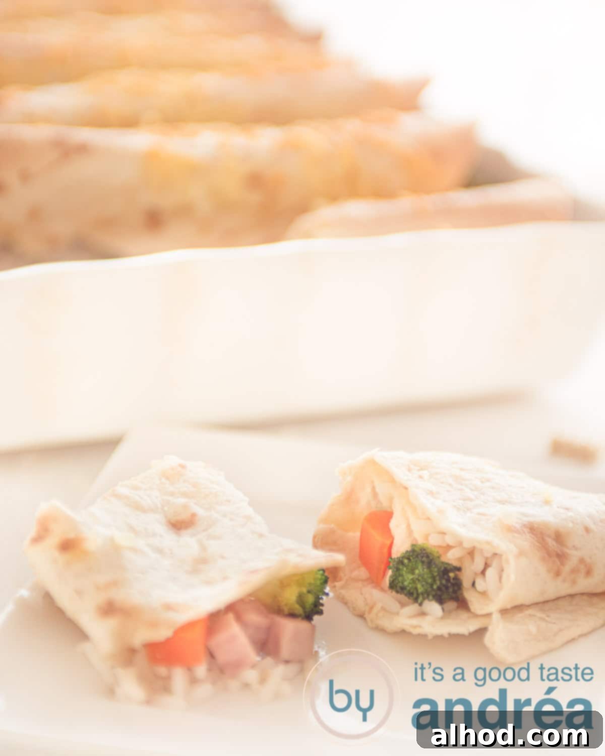 Delicious Ham and Carrot Rice Bake 9 Two half wraps filled with rice, carrots, broccoli and ham and a casserole in the background