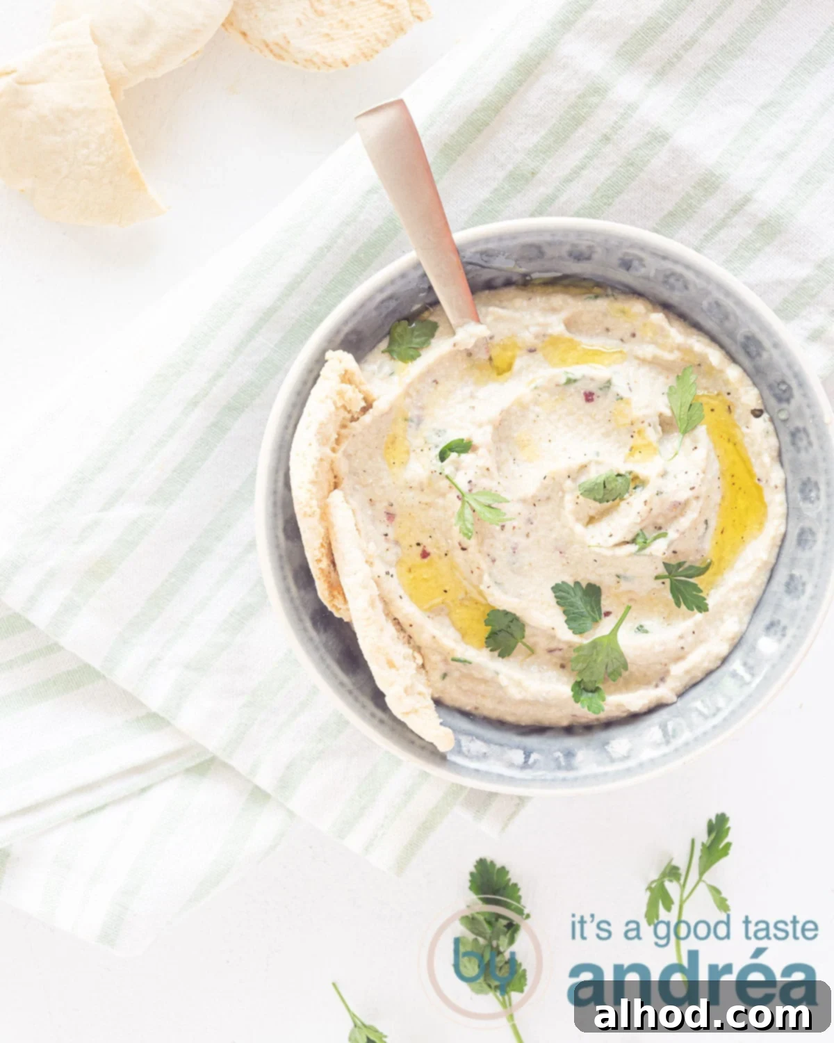 Melitzanosalata Smoky Greek Roasted Eggplant Dip 2 top photo of a grey bowl filled with Greek roasted eggplant dip.