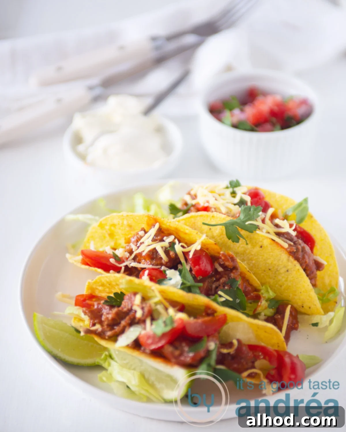 Crispy taco shells filled with spicy minced beef and topped with fresh, homemade tomato salsa.
