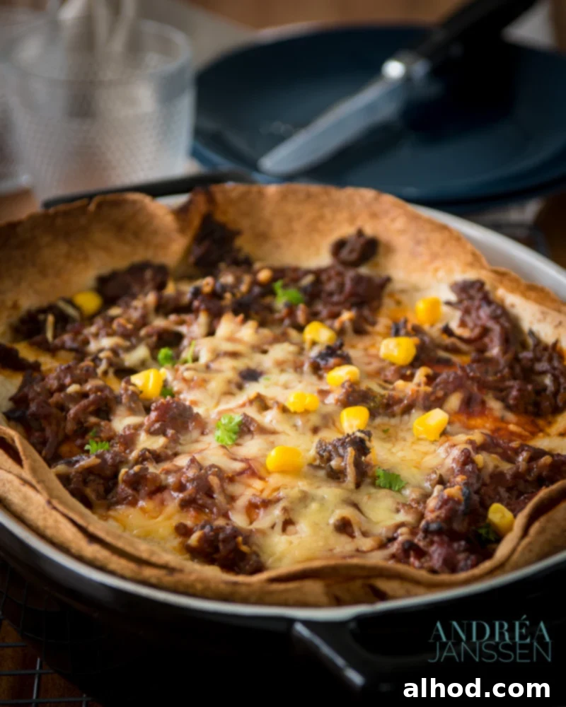 A hearty and delicious enchilada casserole, baked to a golden, cheesy perfection.