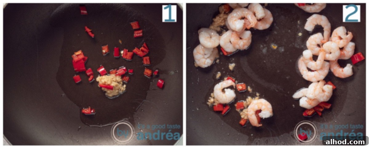 Indonesian Noodle Salad with Shrimp 4 a frying pan with garlic and red pepper and shrimp that are fried.