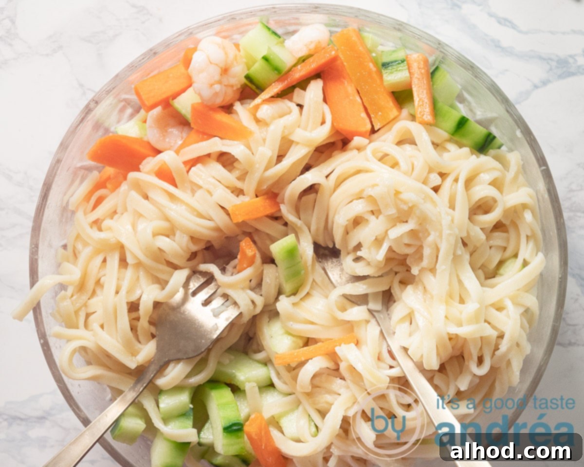 Indonesian Noodle Salad with Shrimp 7 Stirring the bami noodles through the vegetables and shrimp salad