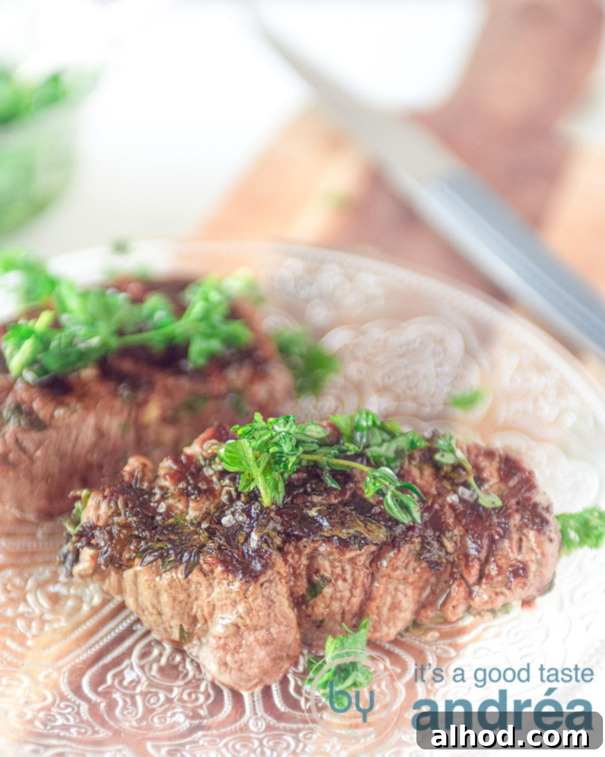 Green Herb Marinated Grilled Flat Iron Steak 2 Perfectly grilled flat iron steak with a vibrant green herb marinade, sliced to show a juicy, rosé interior.