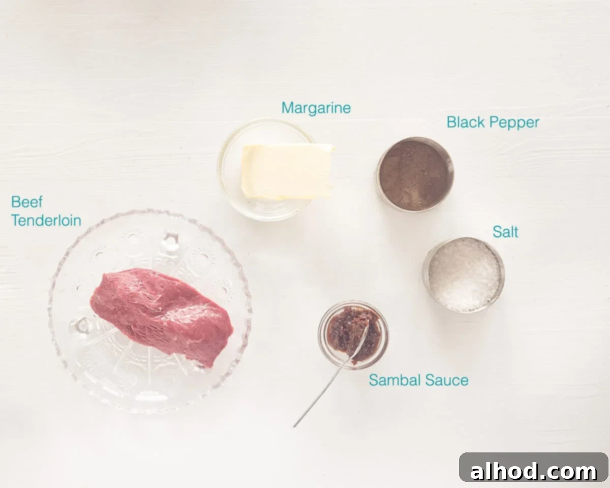 A curated flat lay photograph showcasing all the essential ingredients for Loetje's Beefsteak Bali, neatly arranged on a crisp white background with descriptive text labels. Includes beef tenderloin, margarine, Sambal Oelek, salt, and pepper.