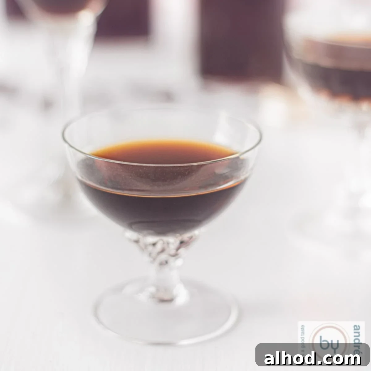A square picture of a glass filled with Tia Maria