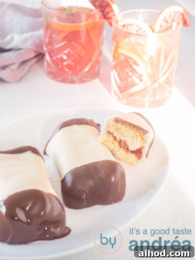 Mergpijpjes Beloved Dutch Marzipan Treats 6 A close-up of a perfectly crafted Mergpijpje, showing the marzipan exterior and chocolate-dipped ends.