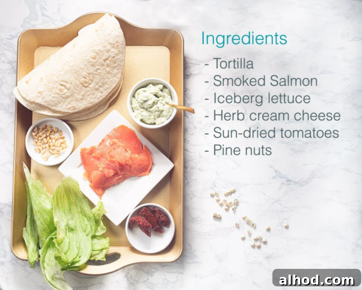 10-Minute Smoked Salmon Pinwheels 3 A flat lay image displaying the fresh ingredients for salmon cream cheese pinwheels on a marble background, including tortillas, smoked salmon, cream cheese, sun-dried tomatoes, iceberg lettuce, and pine nuts.