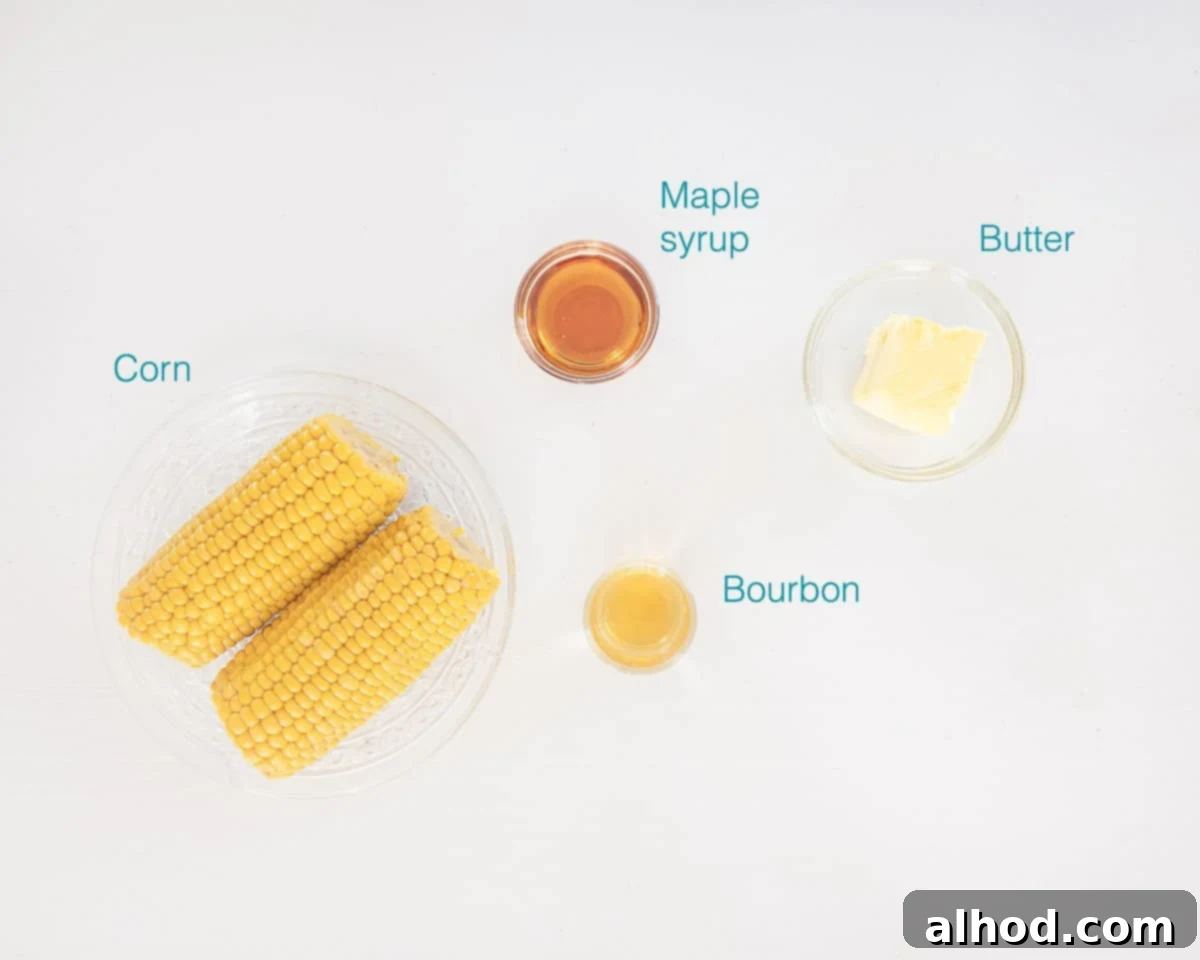 Fire-Kissed Bourbon Butter Corn 3 Individual ingredients for Bourbon Butter Grilled Corn neatly arranged on a white background, including fresh corn, a stick of butter, maple syrup, a bottle of bourbon, and shakers of salt and pepper.
