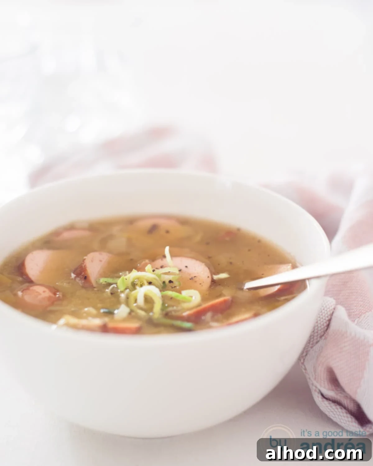 Grandma's Hearty Split Pea Soup 3 a bowl with split pea soup and rye bread with. bacon