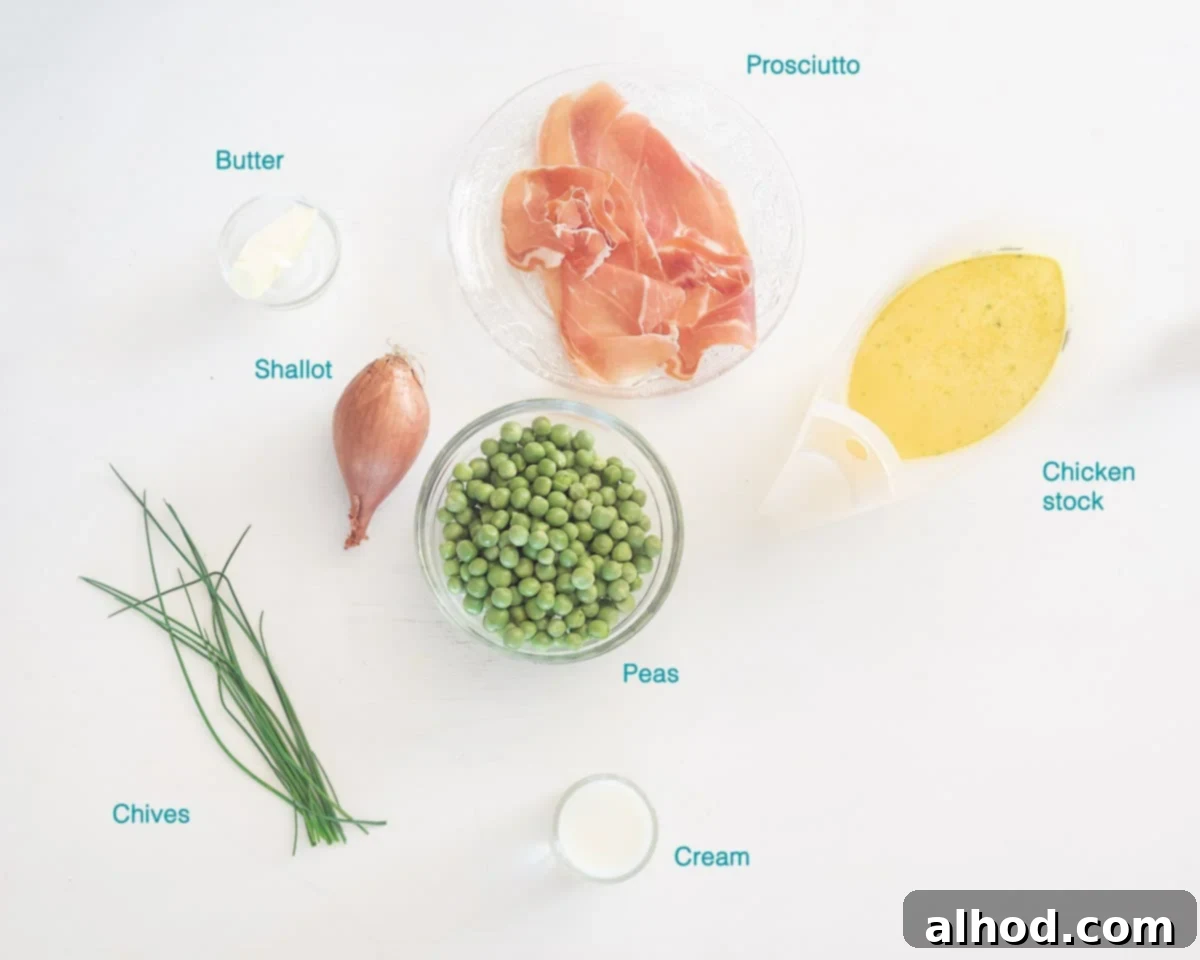 Garden Fresh Pea Soup 3 A flat lay of fresh pea soup ingredients including shallots, fresh peas, chives, cream, butter, chicken stock, and prosciutto, neatly arranged on a white background.