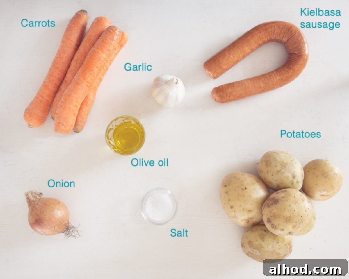 One-Pan Sausage Dinner 3 A clean, elevated shot of all the individual ingredients needed for the Simple Sausage Traybake, each clearly labelled on a bright white background, ready for prep.