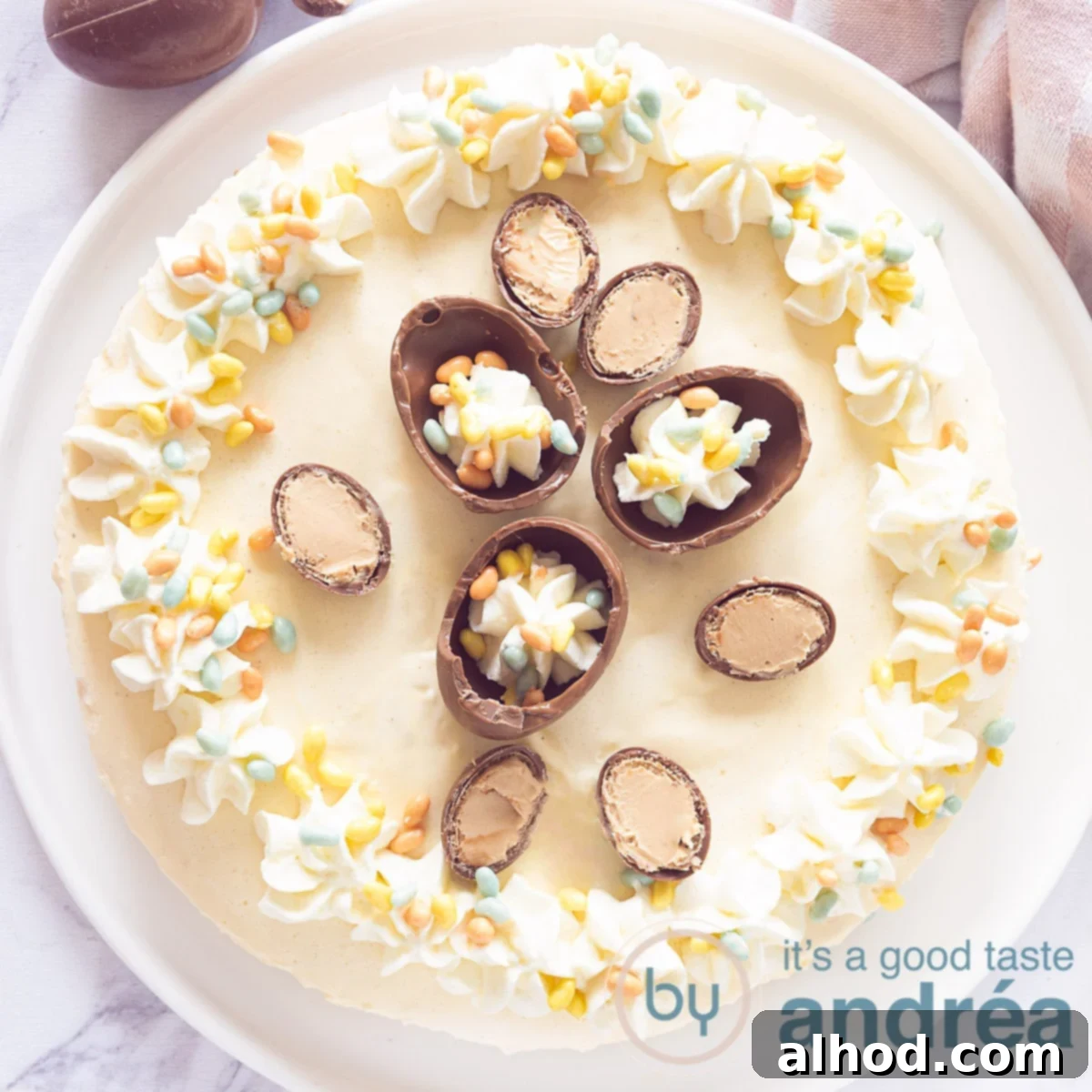 A square photo of a no-bake eggnog Easter cake with whipped cream and eggnog on a white background.