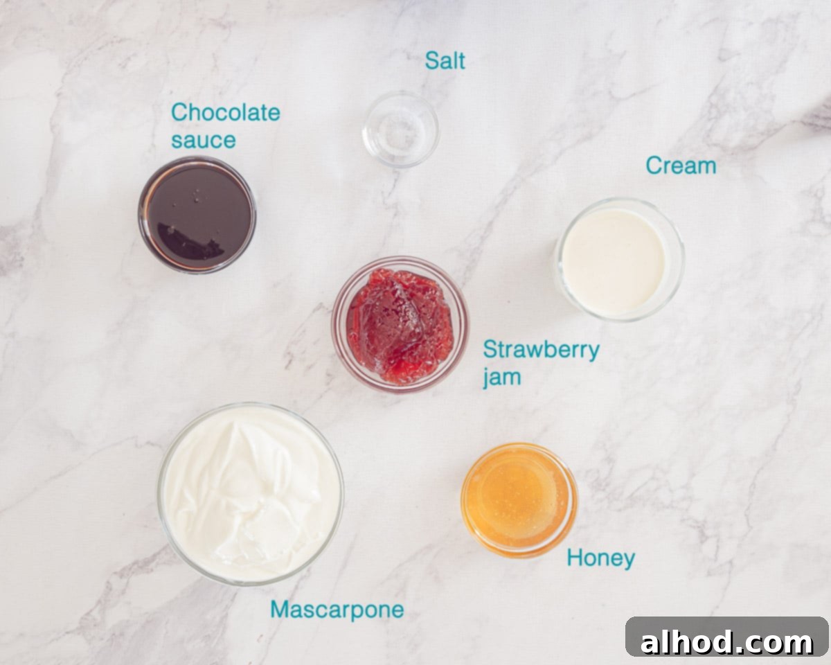 Chocolate Strawberry Froyo Treat 3 A flat lay photo showing individual ingredients for Chocolate Frozen Yogurt with Strawberries on a white background: heavy cream, honey, salt, Greek yogurt, strawberry jam, chocolate sauce, and fresh strawberries.