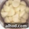 A pan filled with peeled potatoes and water.