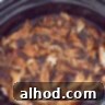 Effortless Slow Cooker BBQ Pulled Chicken 9 A slow cooker filled with pulled chicken.