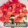 A bowl with diced sweet point pepper and zucchini