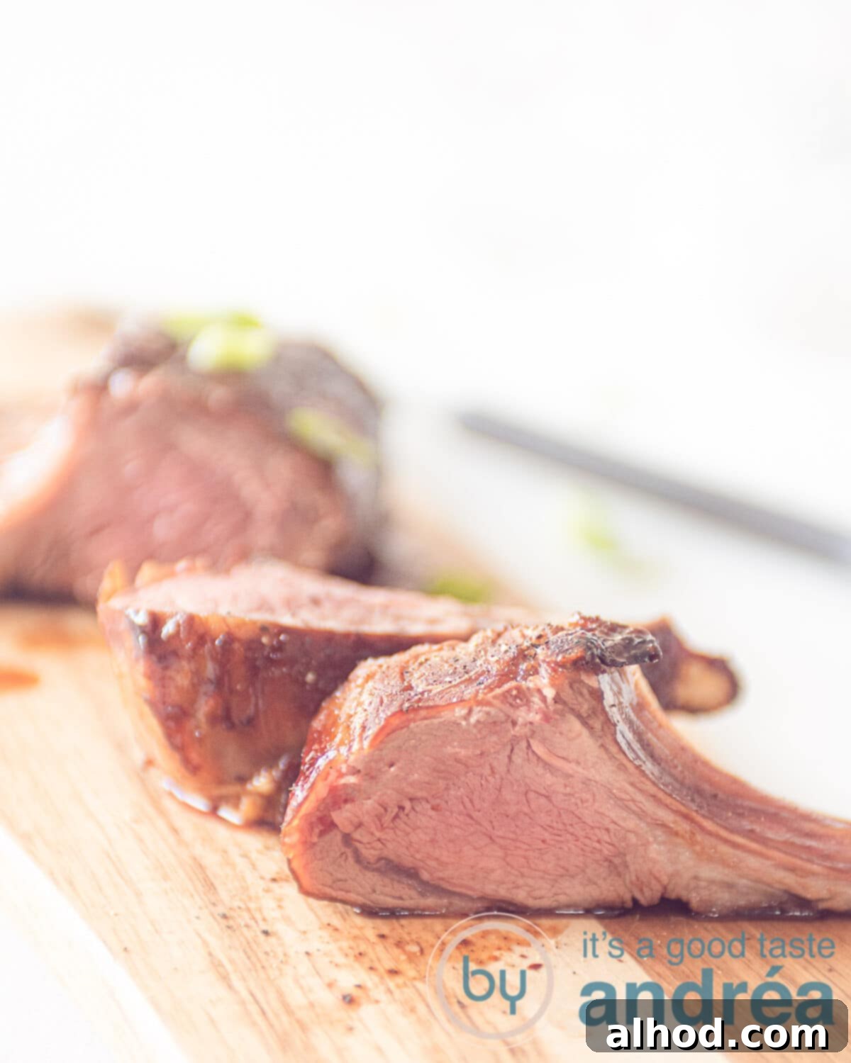 A wooden plate with lamb chops