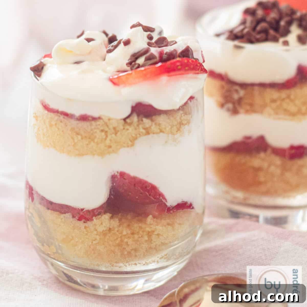 Strawberry Pound Cake Mini Trifles 4 A square photo with two glasses filled with strawberry trifles