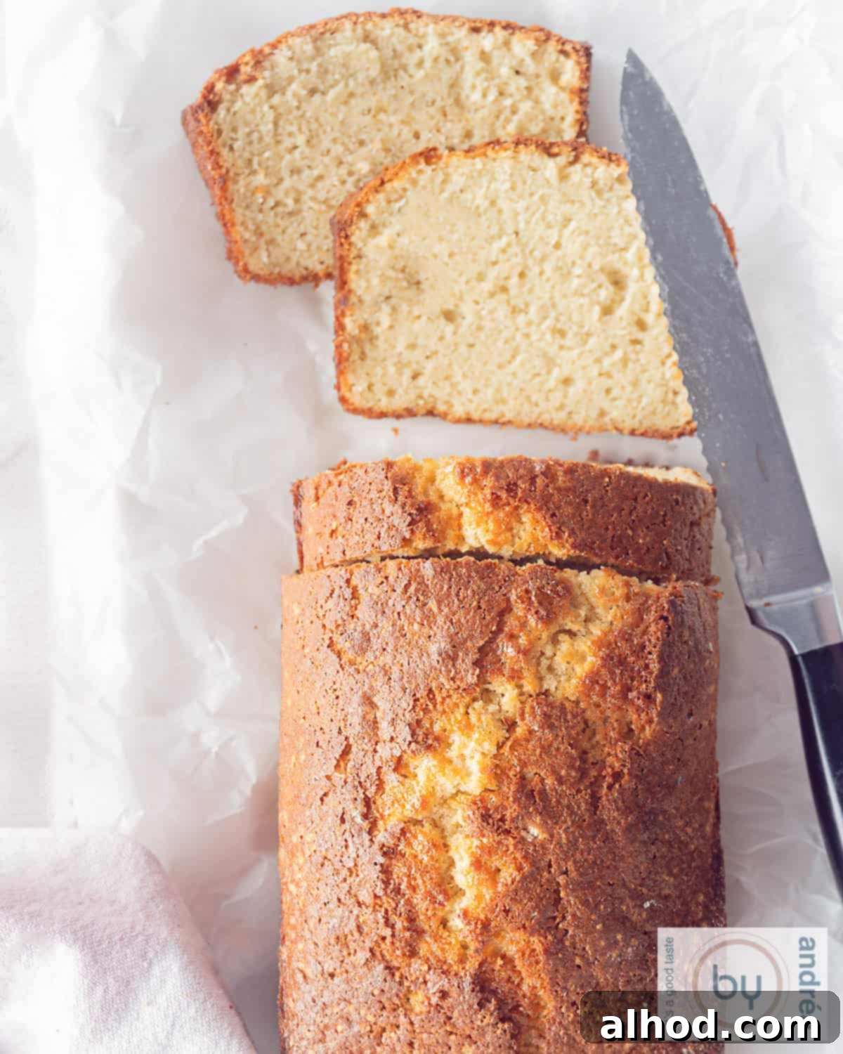 Effortlessly Light and Fluffy Vanilla Applesauce Cake 2 An height photo of a portion of an applesauce cake with three slices cut and two slices lying flat.