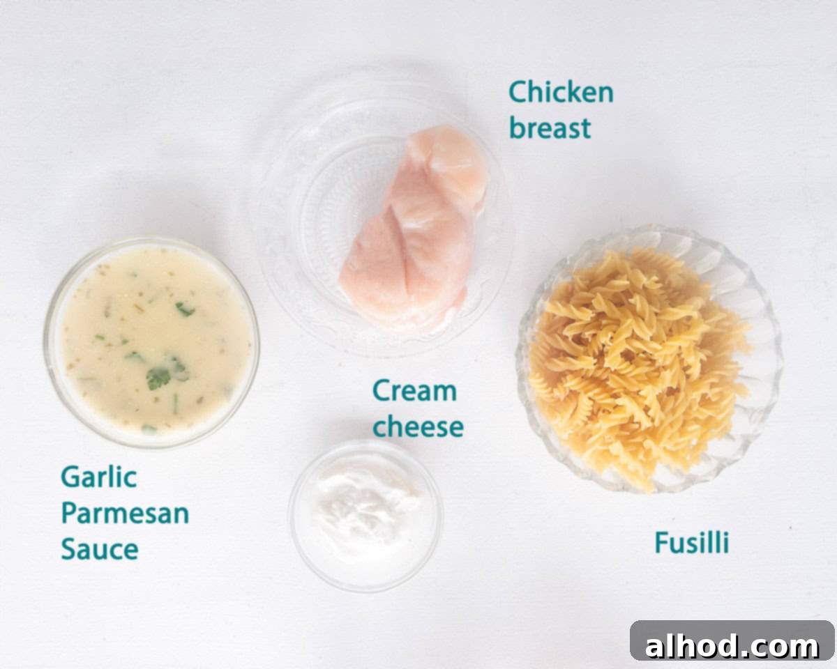 Creamy Garlic Parmesan Chicken and Fusilli in the Slow Cooker 3 Ingredients for Slow Cooker Chicken with Garlic Parmesan Sauce laid out on a white background with descriptive text.