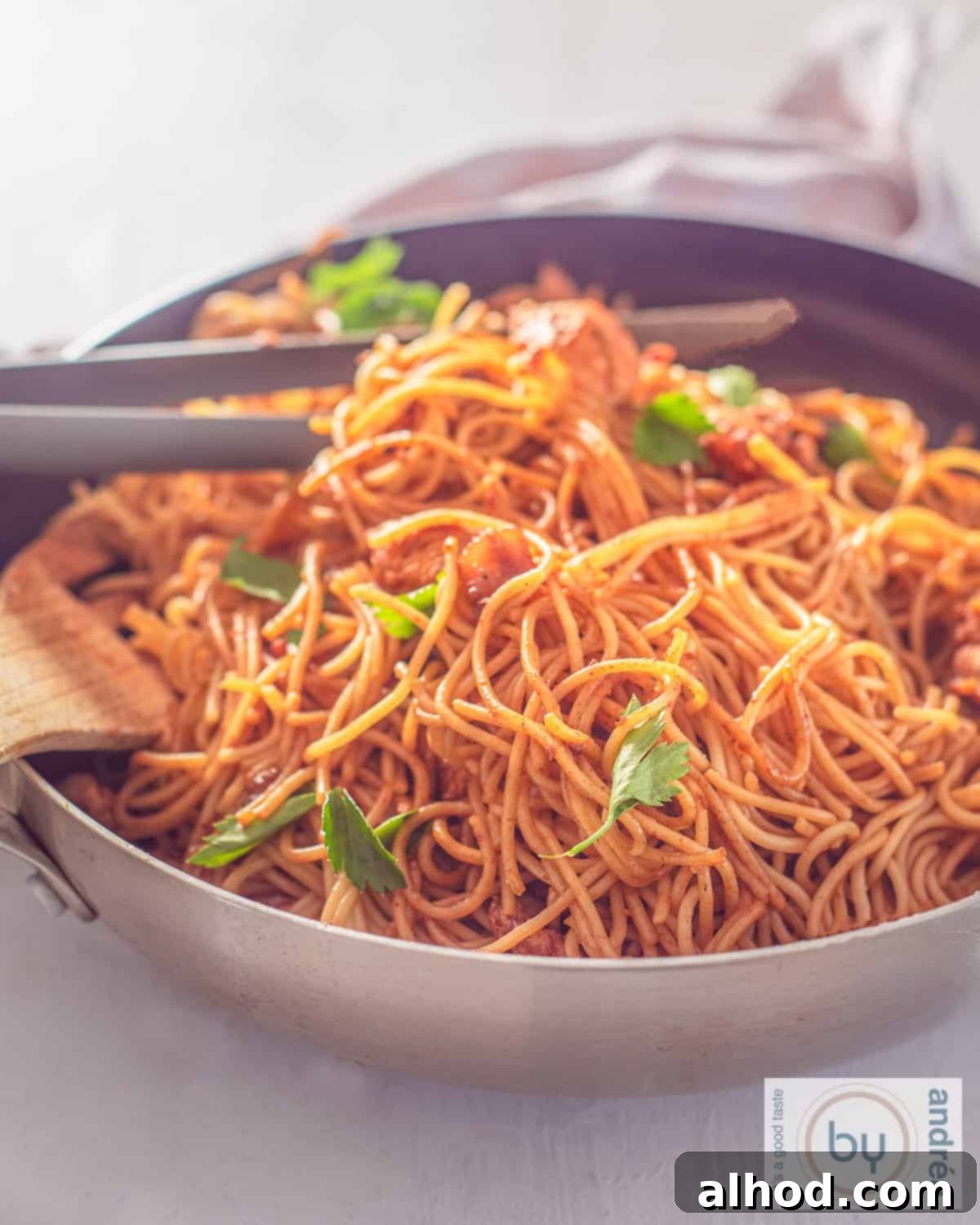 Whip Up Delicious Surinamese Bami Fast 2 Part of a wok filled with homemade Surinamese bami with chicken and celery