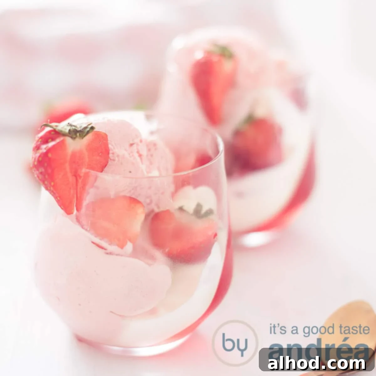 Kids Festive Feast 6 A square photo with two strawberry desserts with ice cream, jelly, whipped cream and fresh strawberries on a white background