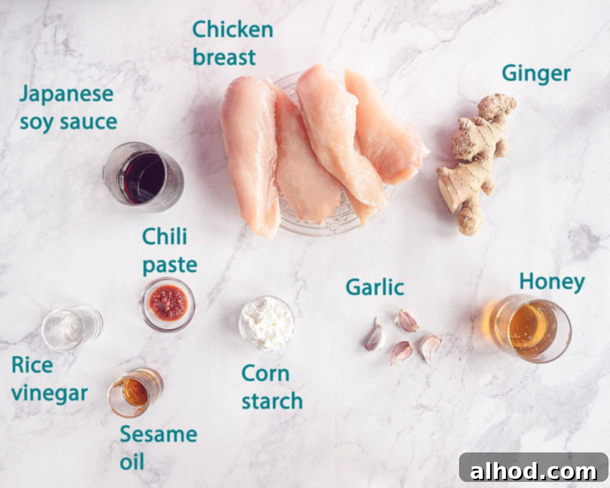 Easy Honey Garlic Slow Cooker Chicken 3 Ingredients for Honey Garlic Chicken from the Slow Cooker on a white marble background with individual text description for each ingredient.