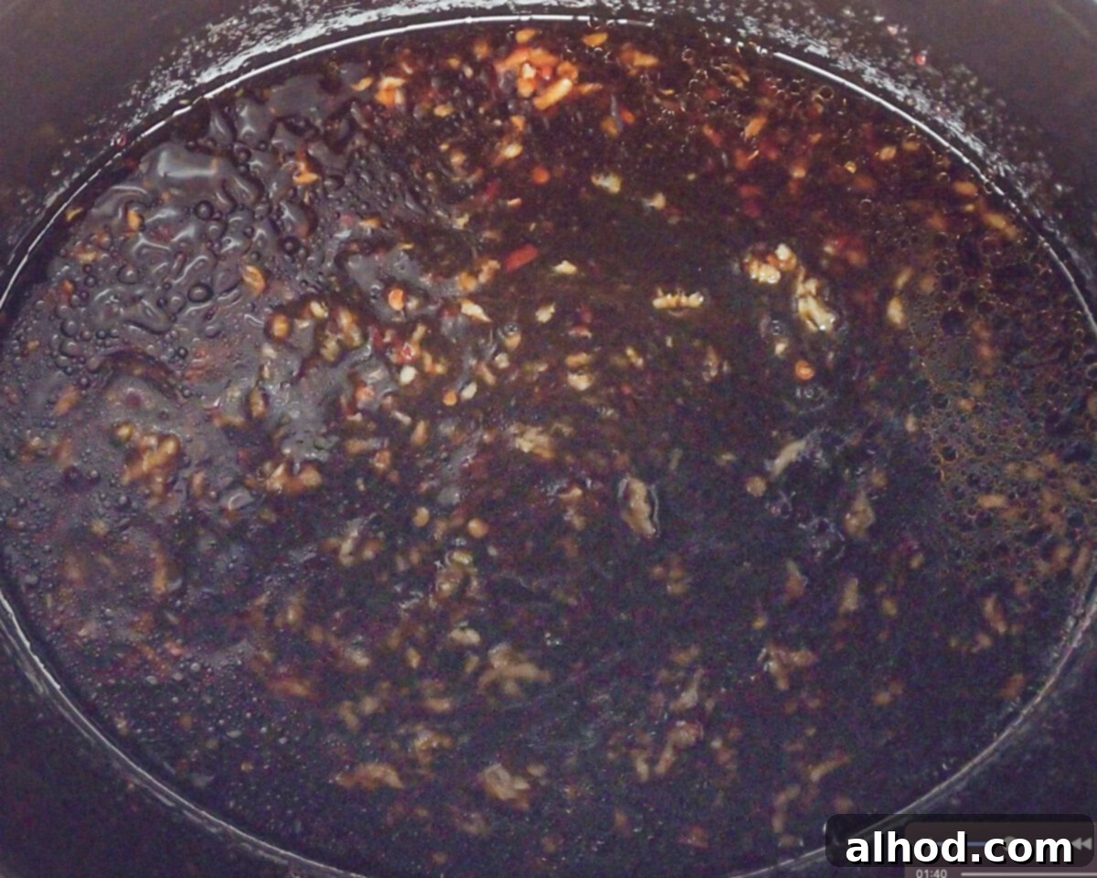 Easy Honey Garlic Slow Cooker Chicken 5 A honey garlic marinade in the bottom of a slow cooker