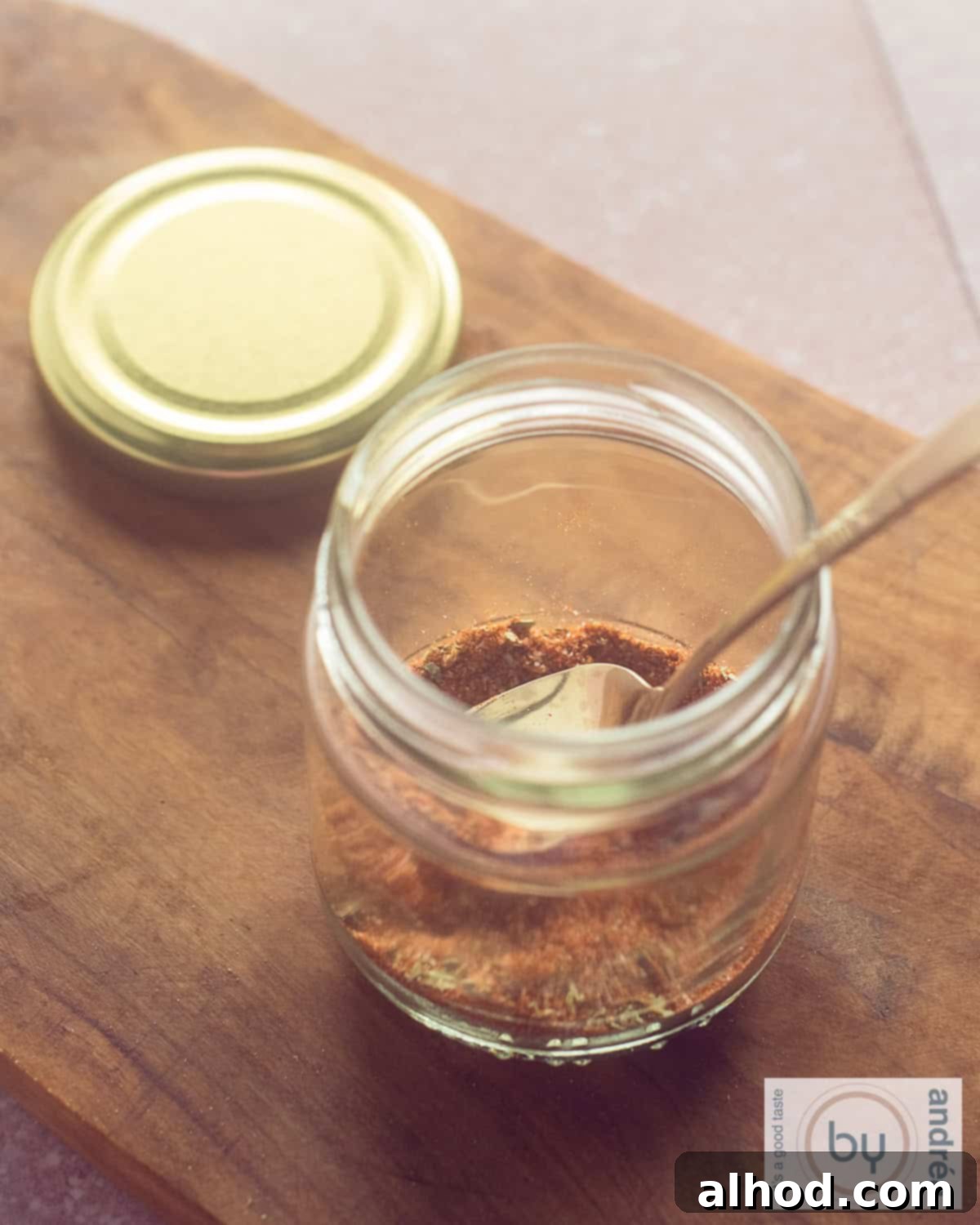 Homemade Taco Seasoning 3 A jar of taco seasoning on a wooden board