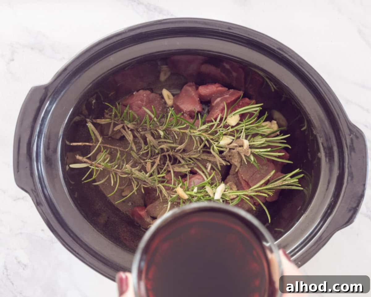 Peposo Tuscan Red Wine Beef Stew 5 Slow cooker with meat, herbs and wine added