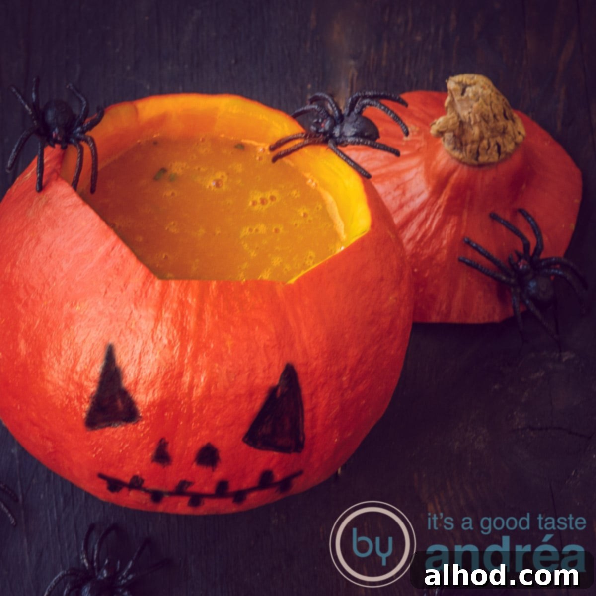 9 Delightfully Light Soups Packed with Fresh Vegetables 9 an orange pumpkin filled with pumpkin soup and spiders