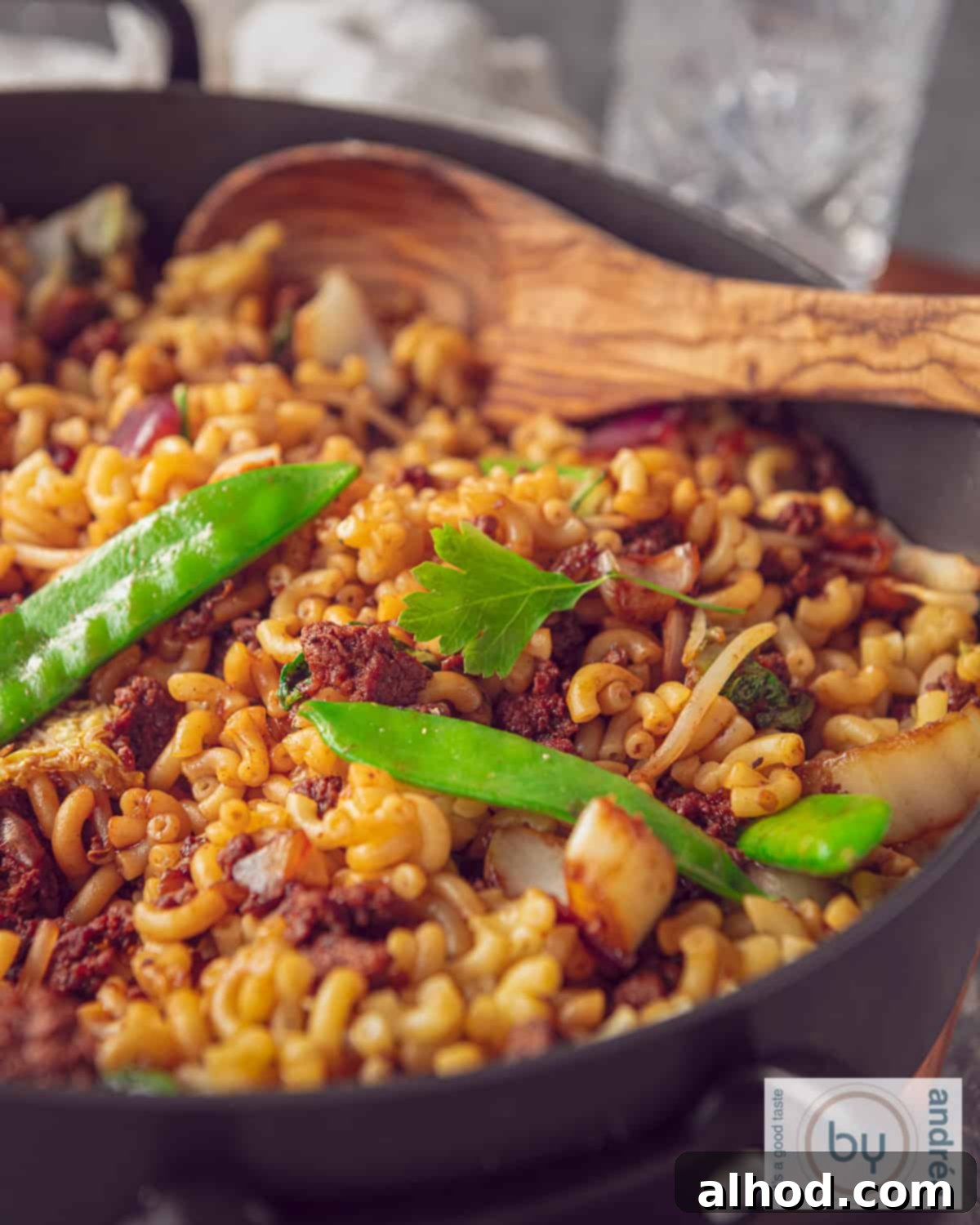 Part of a snack pan filled with Indonesian macaroni with minced meat and vegetables.