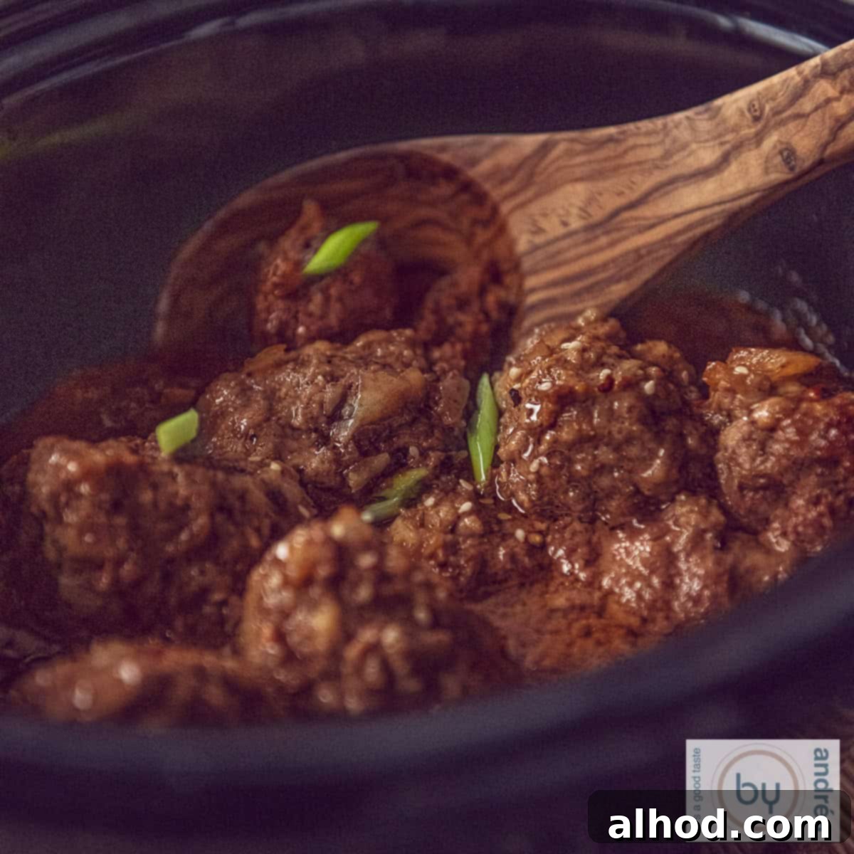 Indonesian Slow Cooker Meatballs in Savory Soy 4 A square photo of a slow cooker filled with Indonesian meatballs in ketjap sauce