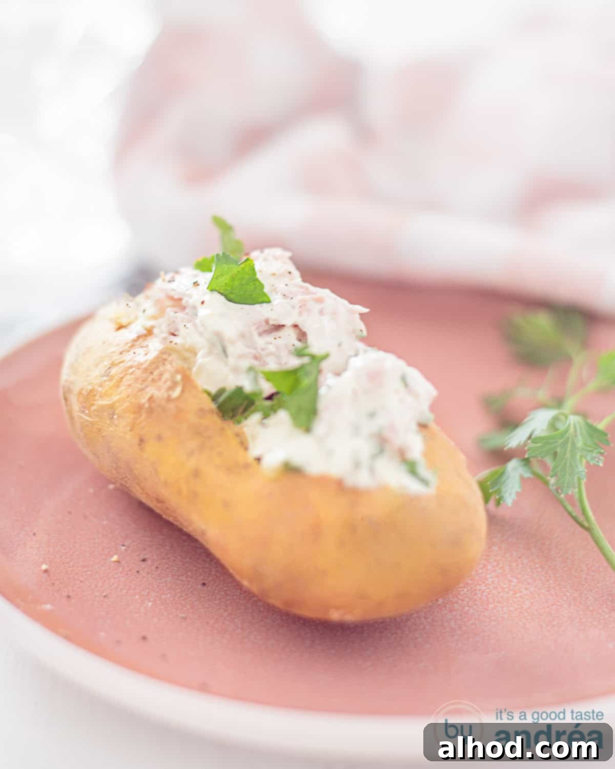 Cottage Cheese Stuffed Spud Perfection 3 baked potato with herbed cottage cheese on a plate