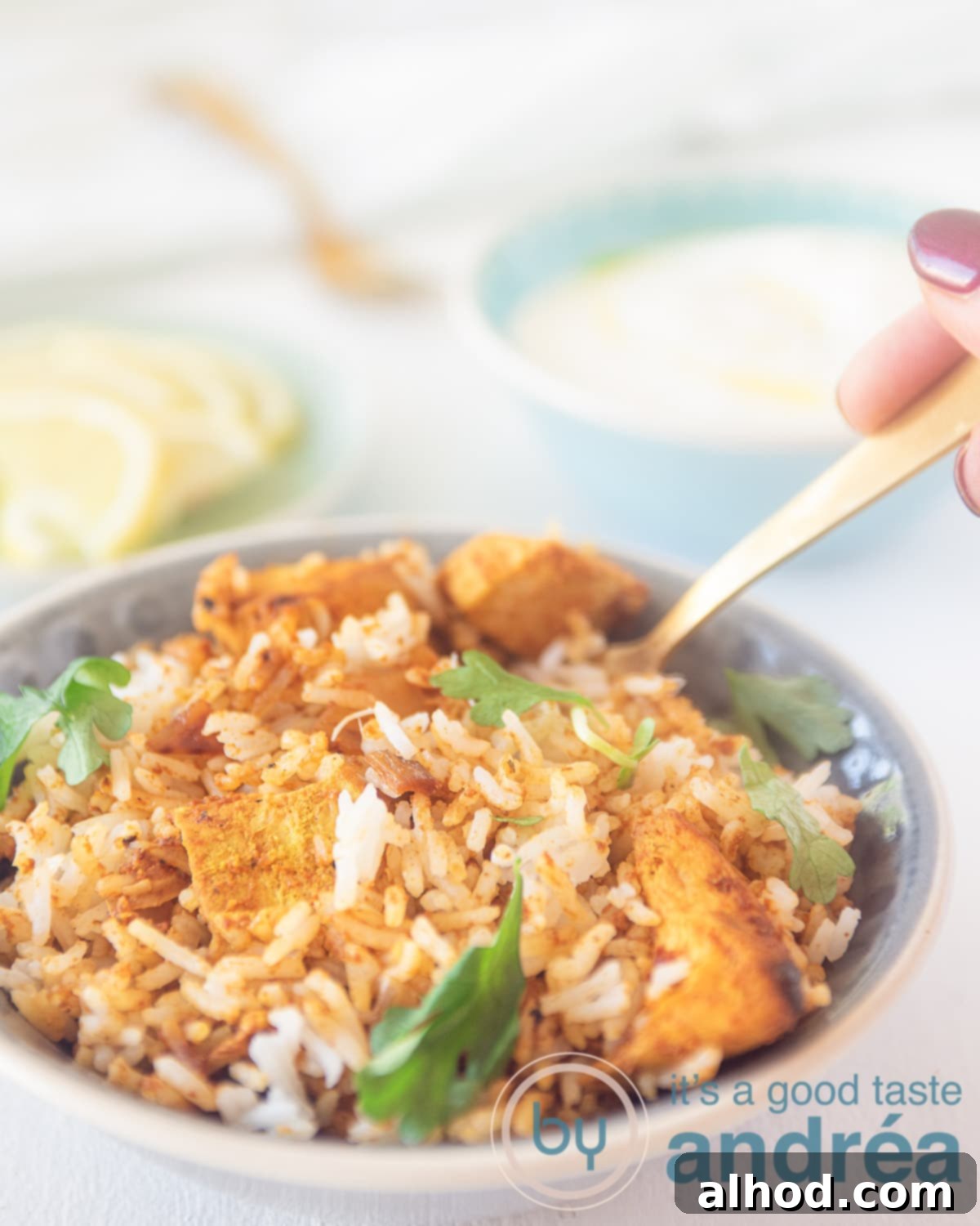 A bowl of freshly made Chicken Tikka Biryani garnished with fresh coriander, showcasing the fragrant basmati rice and tender chicken pieces.