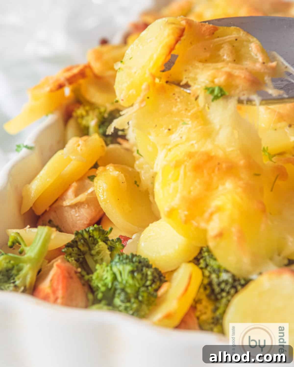 Hearty Chicken Broccoli Potato Casserole 2 Chicken, bacon, broccoli and potato casserole in a white casserole dish