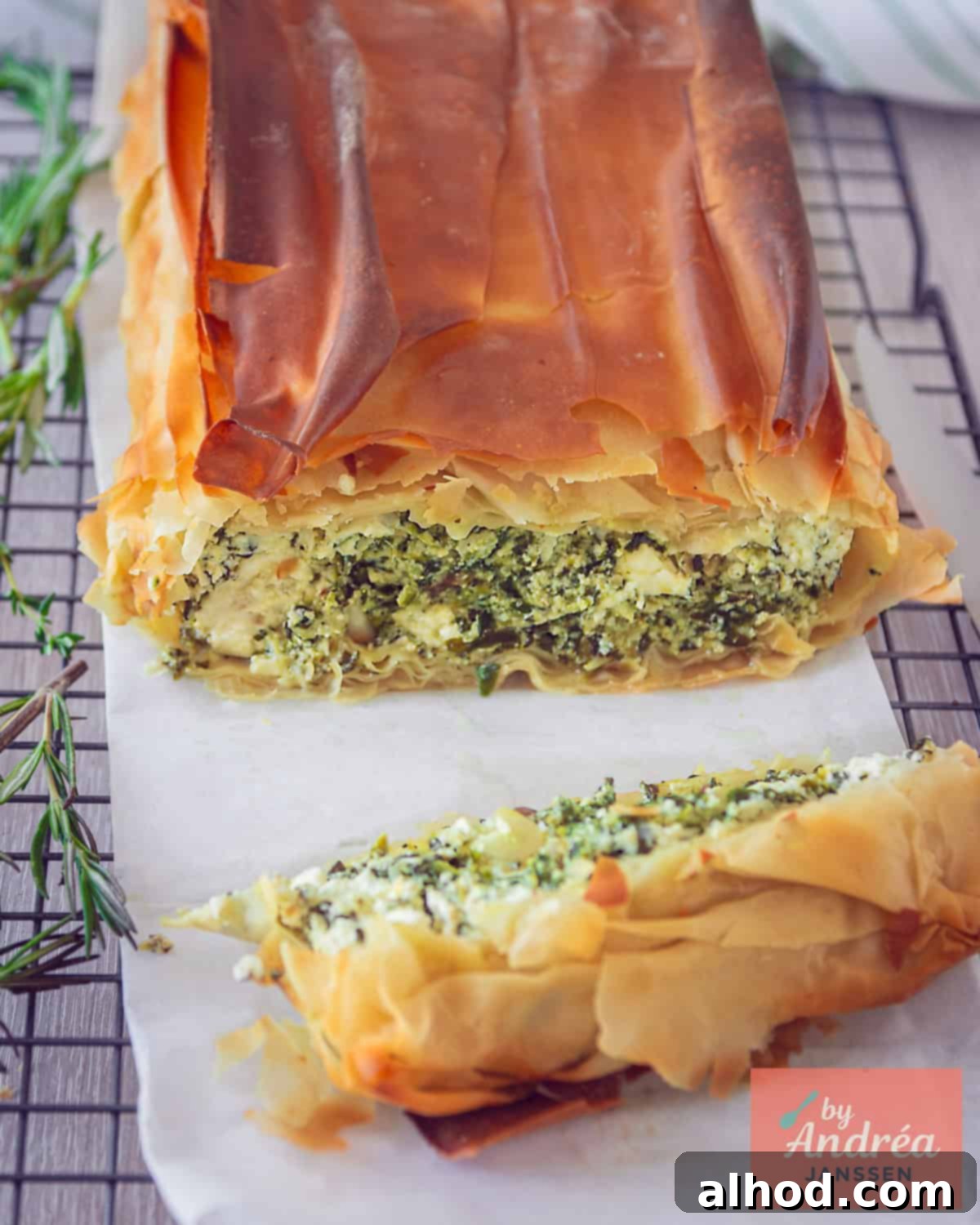Flaky Filo Spinach Ricotta Feta Tart 2 A quiche cut open to clearly see the spinach, feta and ricotta filling.