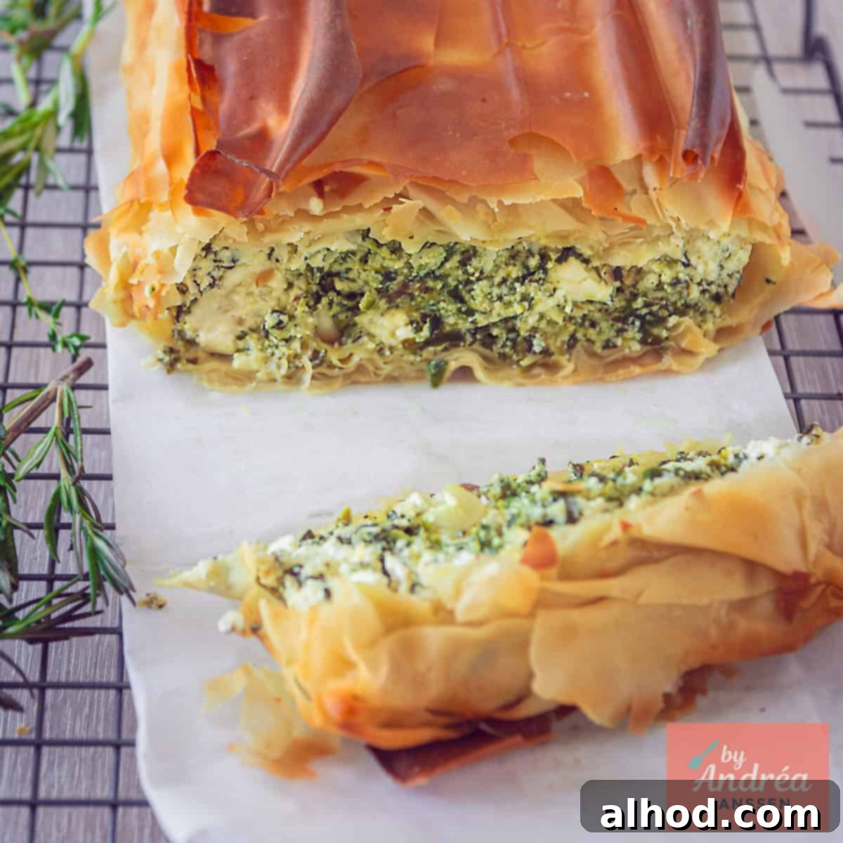 Flaky Filo Spinach Ricotta Feta Tart 4 A square photo of a portion of a savory pie, clearly showing the filling (feta, spinach, and ricotta)
