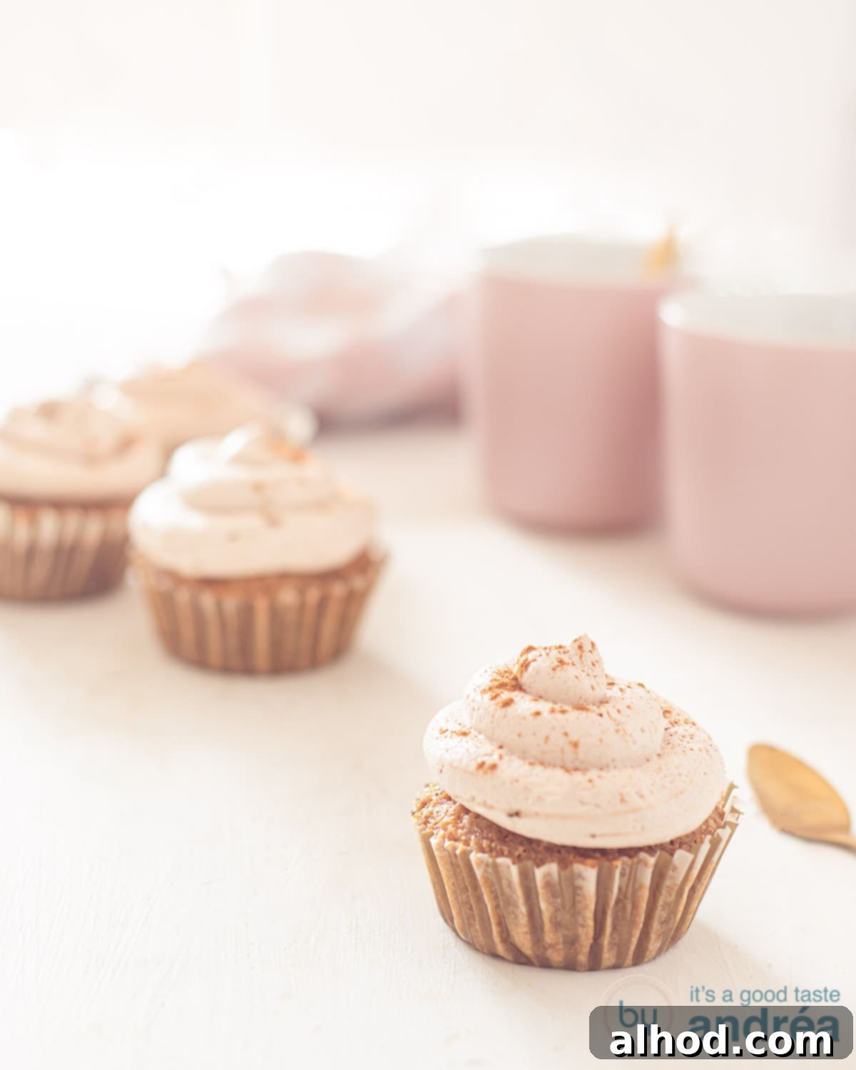 Decadent Tiramisu Cupcakes 1 A tart plate with Tiramisu cupcakes and cocoa dusting, ready to be served at a buffet.