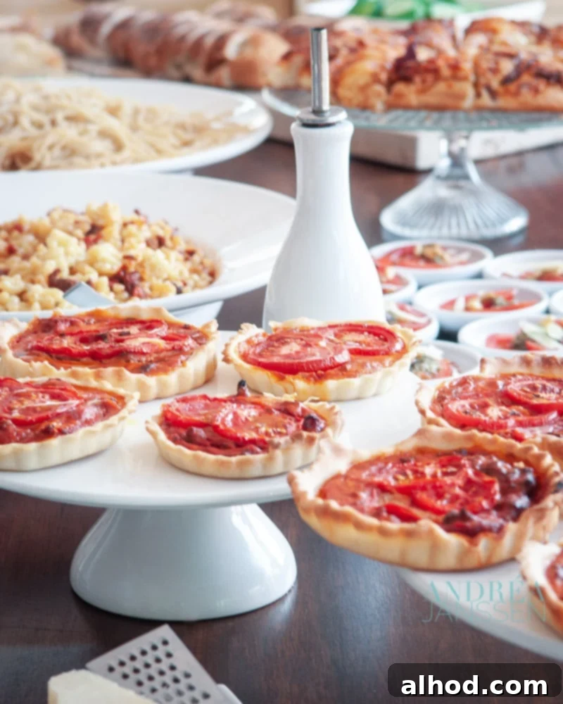Host the Perfect Italian Buffet: 8 Must-Have Recipes & Smart Planning Tips 2 Italian buffet with quiche, macaroni, spaghetti, and various dishes ready for serving