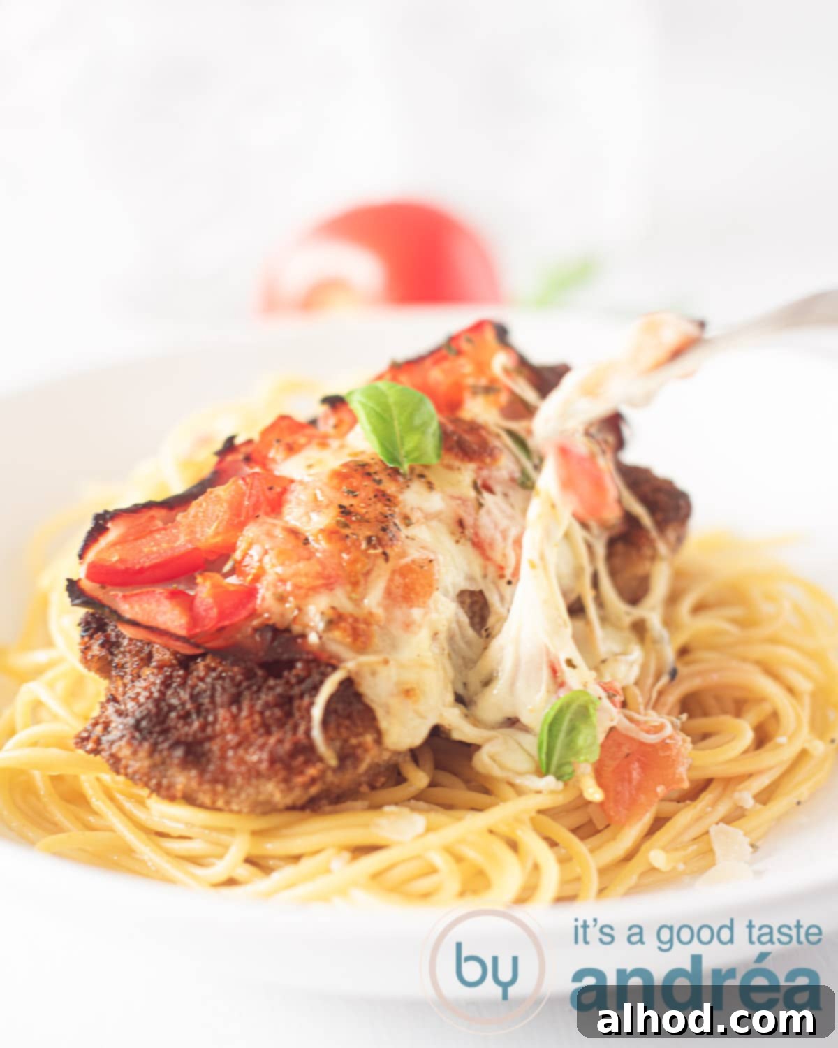 Argentine Milanesa Napolitana: A Crispy, Cheesy Steak Sensation 6 spaghetti topped with Milanesas napolitana
