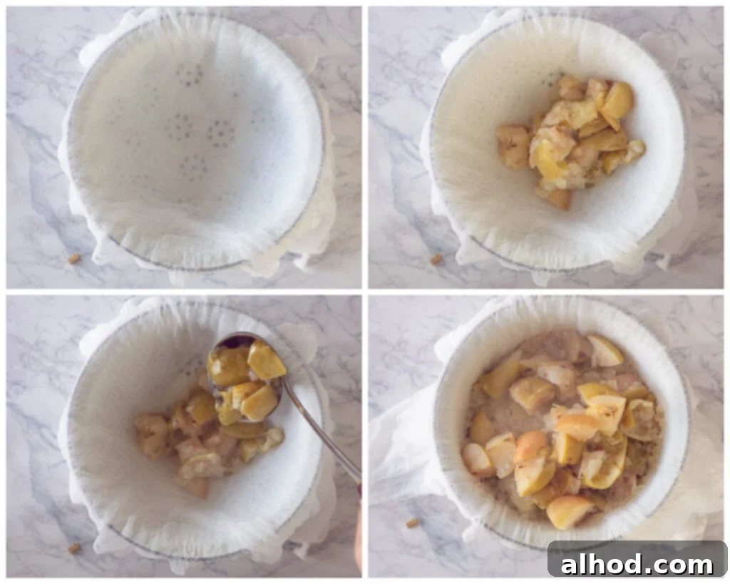 Lavender Kissed Apple Jelly 5 Cooked apple chunks being carefully spooned into a cheesecloth-lined colander, set over a large bowl to drain the juice for jelly making.