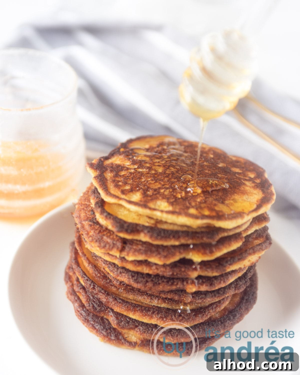 Golden Corn Flapjacks 2 Deliciously fluffy buttermilk cornmeal pancakes stacked high, ready to be served