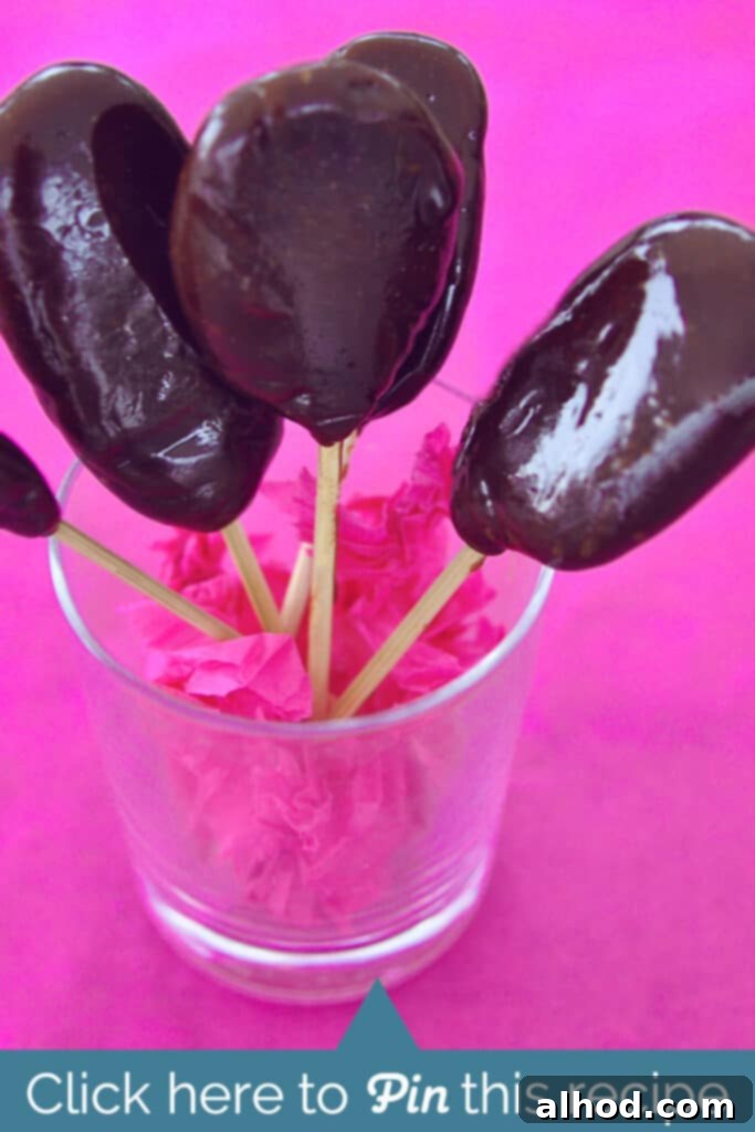 Caramel Swirl Pops 2 Delicious homemade toffee lollipops cooling on a baking mat.