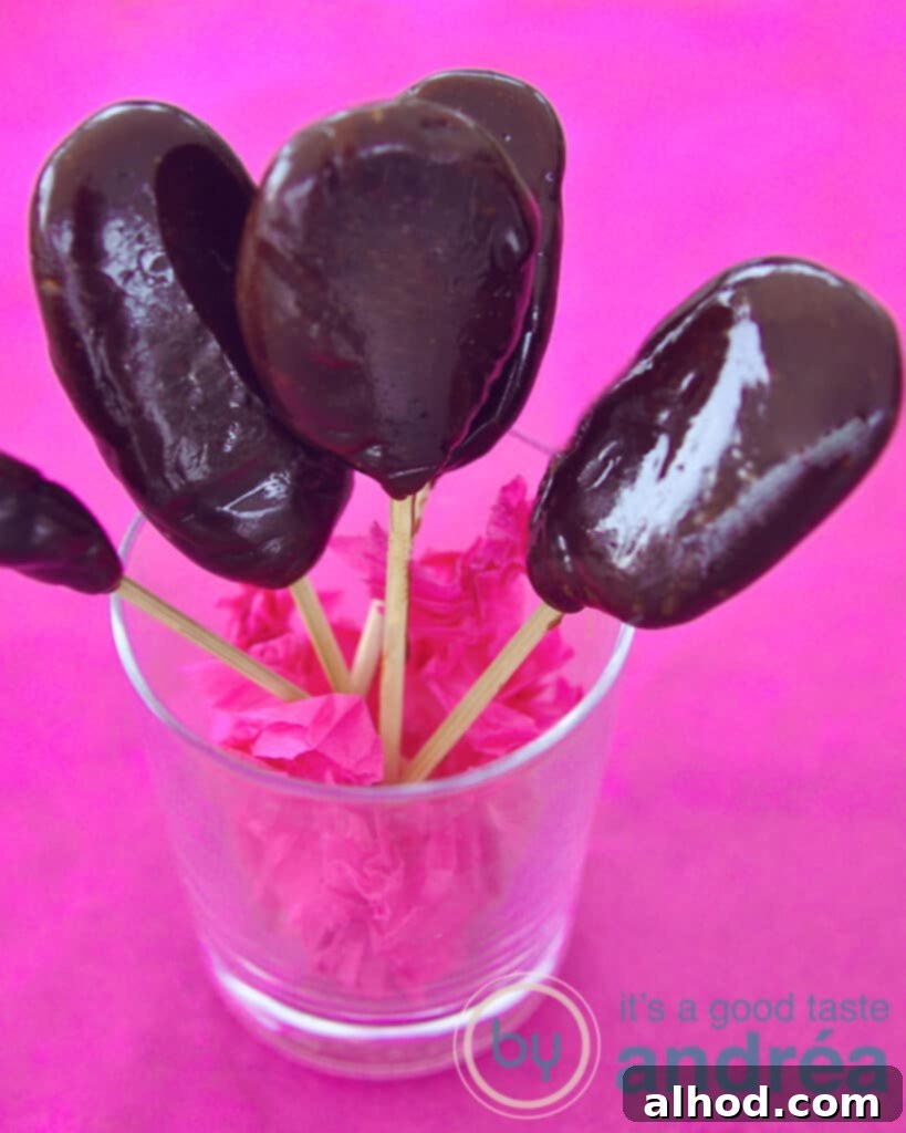 Golden Toffee Pops 3 Beautifully arranged homemade toffee lollipops standing upright in a clear glass, ready for gifting or serving.