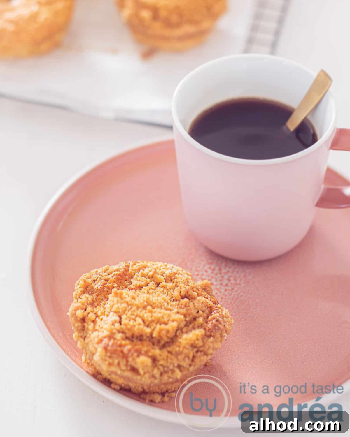 Gingerbread muffins with streusel topping, showcasing their moist and soft texture, perfect for a cozy treat.