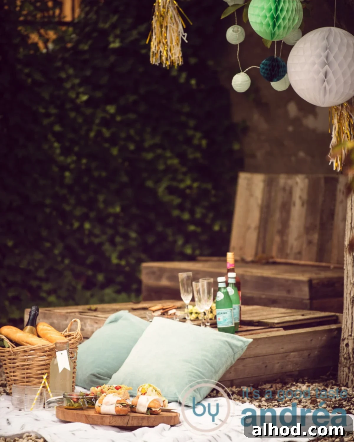 A summer picnic spread with refreshing drinks and a variety of delicious foods on a white plaid blanket, highlighting a joyful outdoor meal.